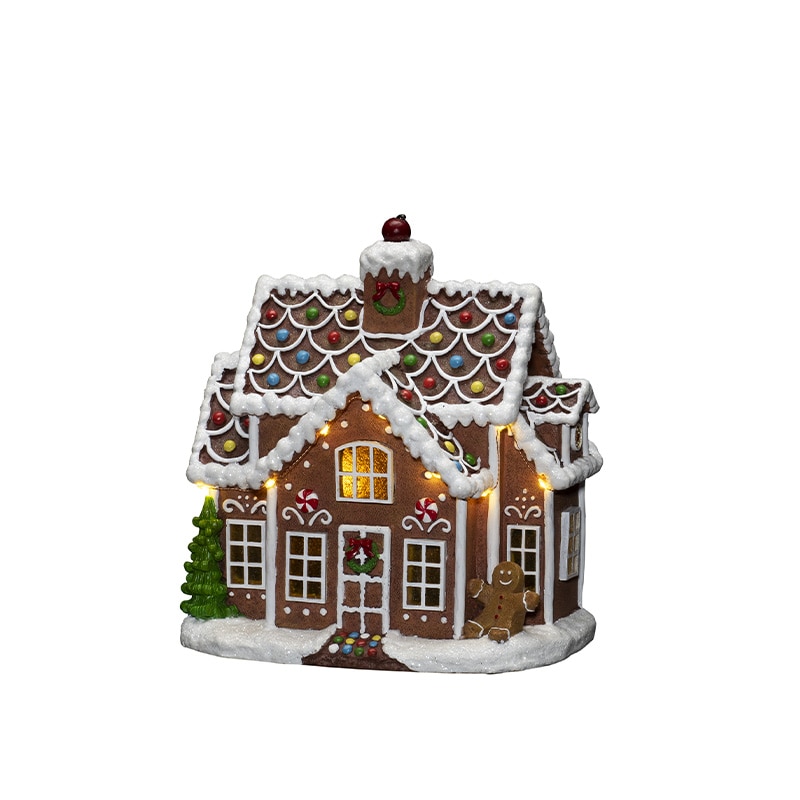 Pepparkakshus med ljus juldekoration